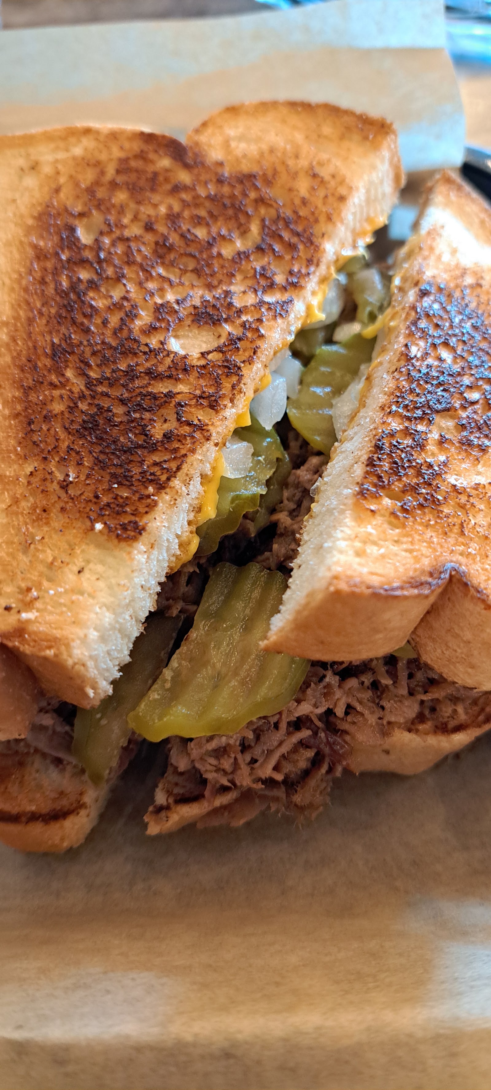 Patty melt sandwich sliced in half